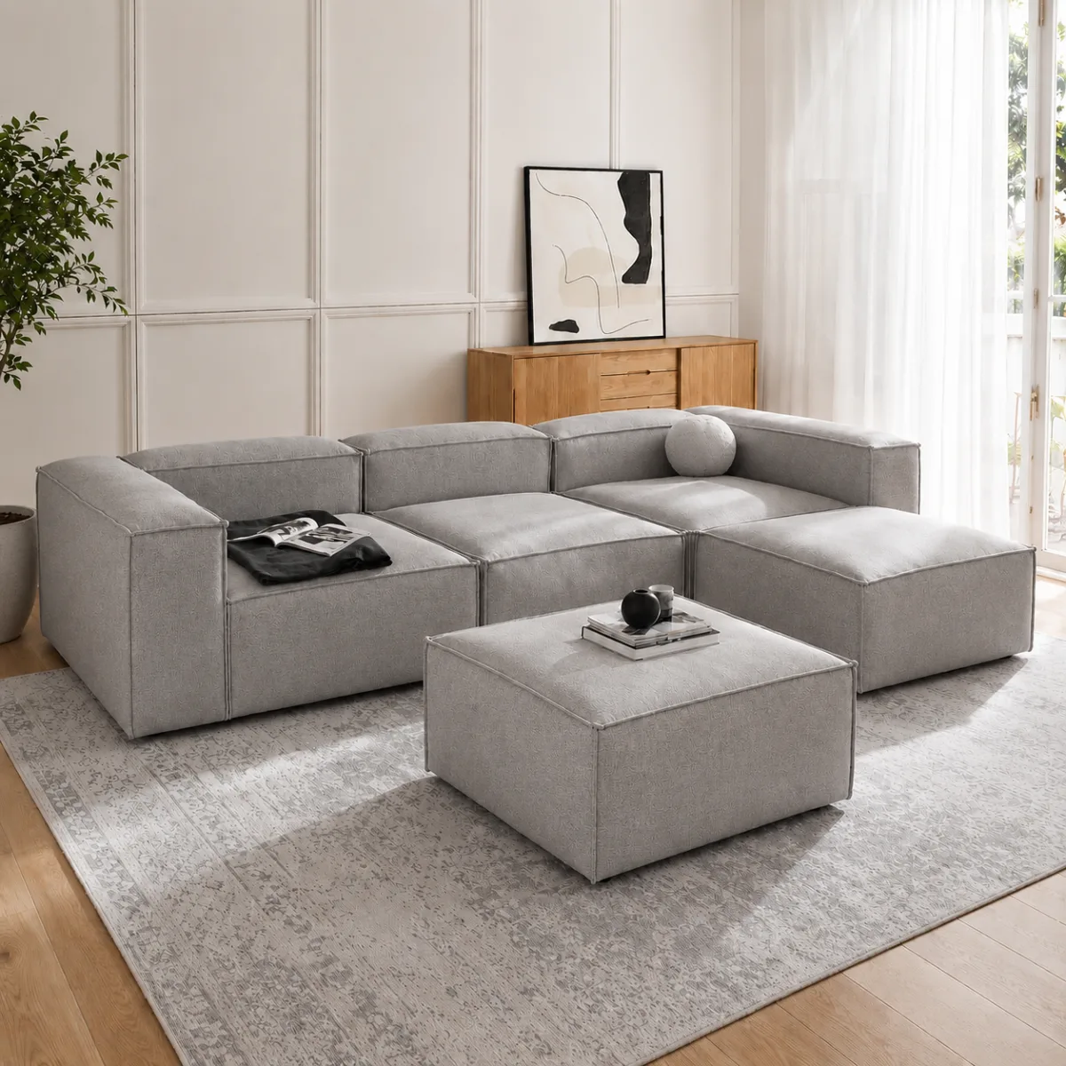 Sofá modular gris de 5 piezas en sala